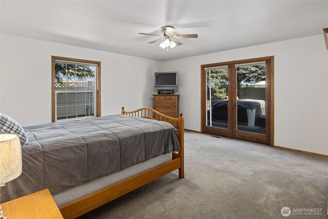 bedroom featuring ceiling fan, baseboards, light colored carpet, and access to exterior