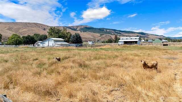 property view of mountains featuring a rural view