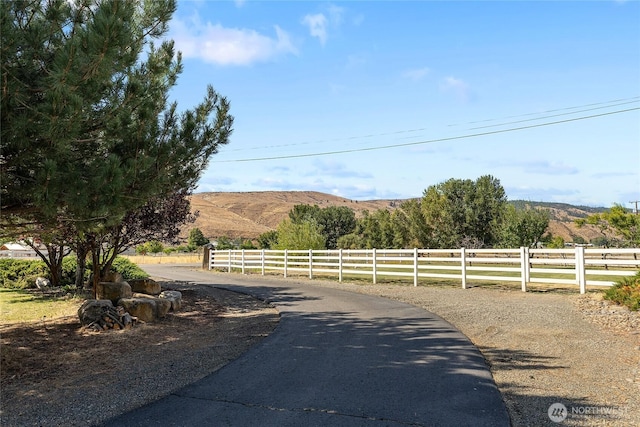 view of road with a mountain view and a rural view