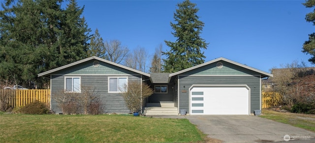 ranch-style home featuring an attached garage, driveway, a front lawn, and fence