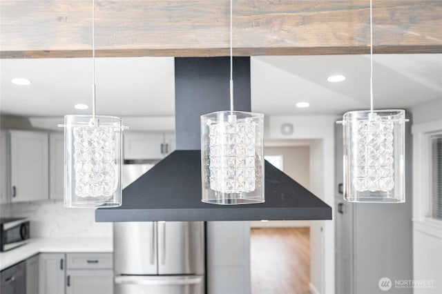 interior details featuring a chandelier, recessed lighting, and stainless steel dishwasher