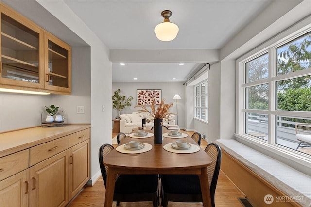 dining space featuring recessed lighting, visible vents, and light wood-style flooring