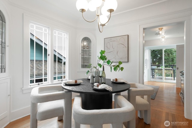 dining room with a notable chandelier and light wood-style floors