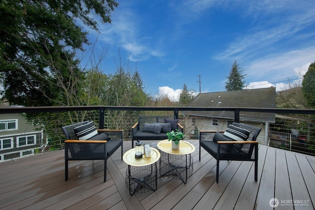 wooden deck featuring an outdoor living space