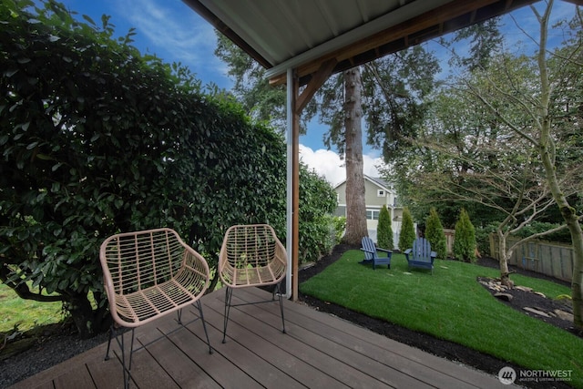 deck featuring a yard and a fenced backyard