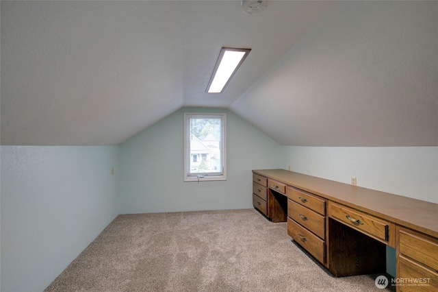446 Eklund Ave, Hoquiam, WA 98550 - unfurnished office with lofted ceiling, built in desk, and light carpet