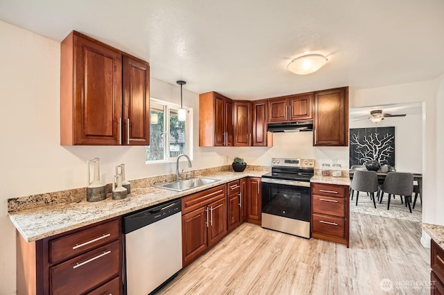 kitchen featuring under cabinet range hood, a sink, stainless steel range with electric cooktop, light wood finished floors, and dishwashing machine