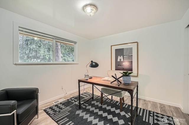 office space featuring wood finished floors and baseboards