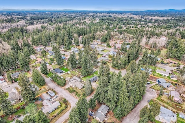 birds eye view of property with a residential view and a view of trees