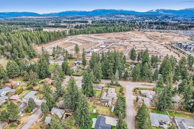 drone / aerial view featuring a mountain view