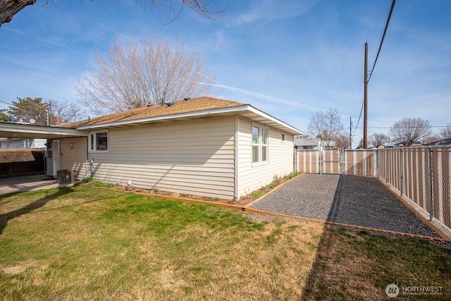 view of property exterior featuring a yard and fence