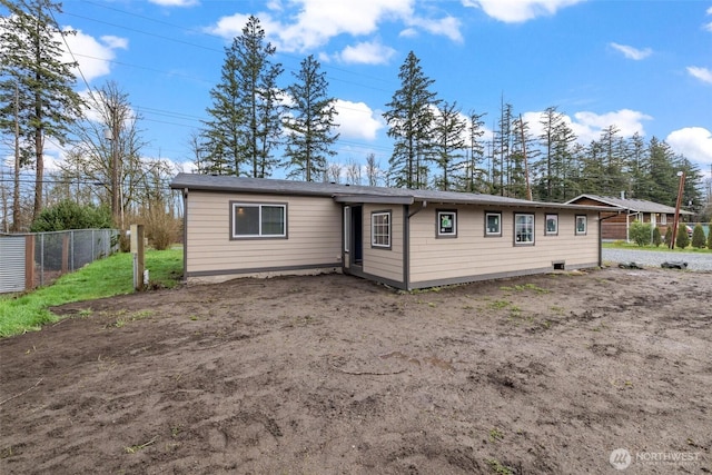 single story home with fence