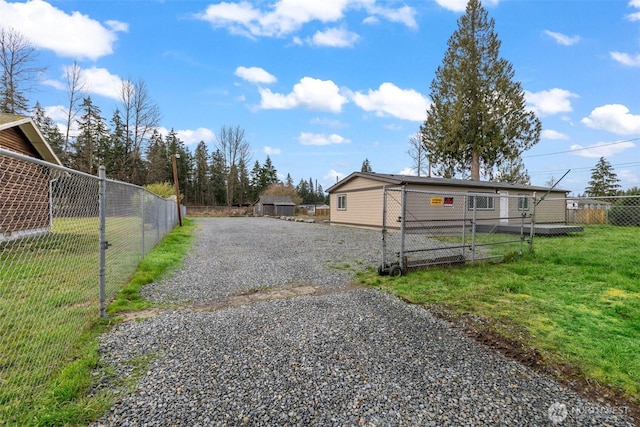 exterior space with gravel driveway