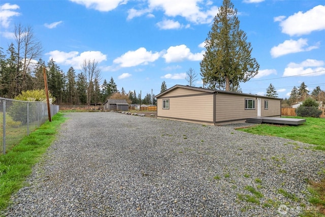 exterior space with a wooden deck and fence