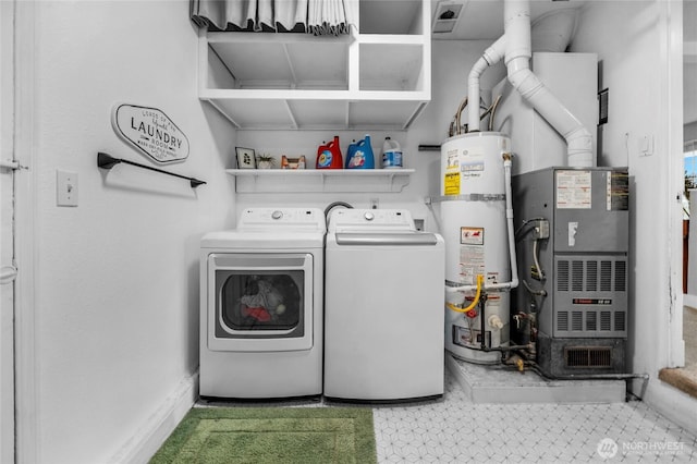 laundry room with heating unit, laundry area, washing machine and dryer, and secured water heater