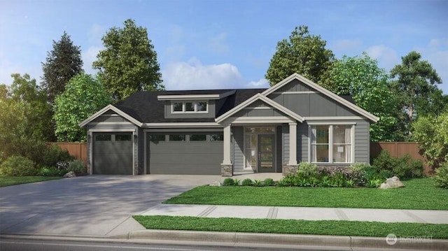 craftsman-style home featuring fence, concrete driveway, a front lawn, a garage, and stone siding