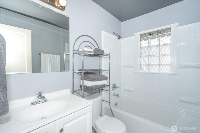 full bathroom featuring bathing tub / shower combination, toilet, and vanity