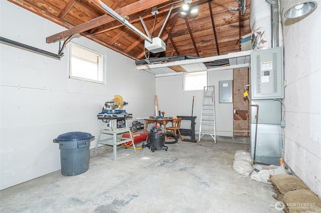 garage featuring electric panel and a garage door opener