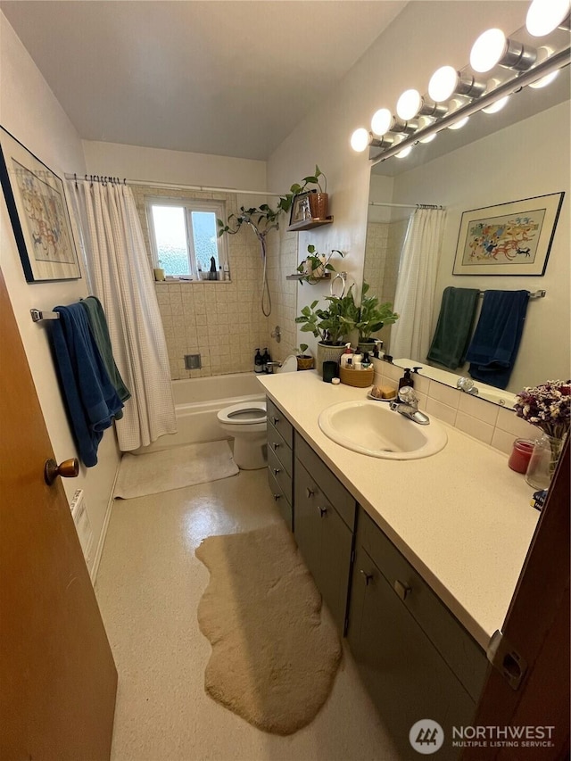 full bath with toilet, vanity, and shower / tub combo