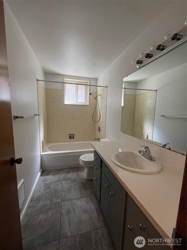 bathroom featuring vanity, toilet, washtub / shower combination, and visible vents