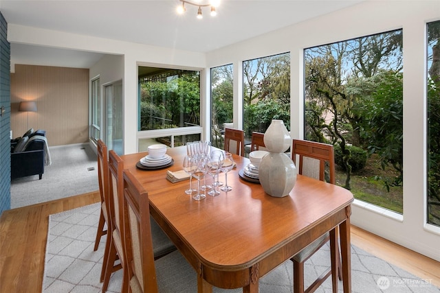 dining area with light wood-style flooring