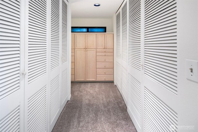 corridor featuring recessed lighting and carpet