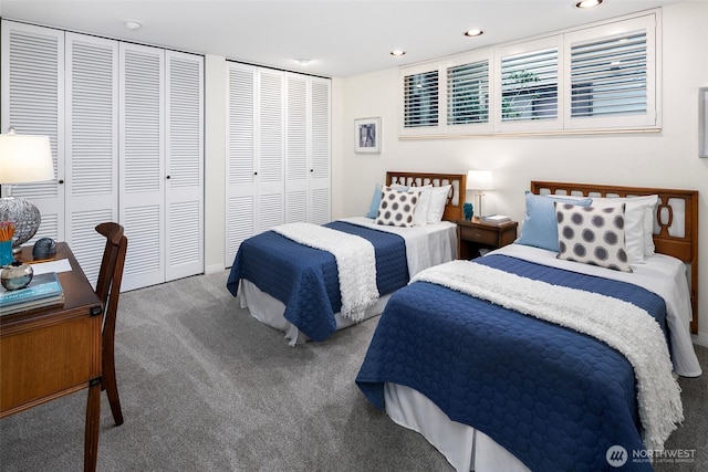 bedroom featuring recessed lighting, multiple closets, and carpet