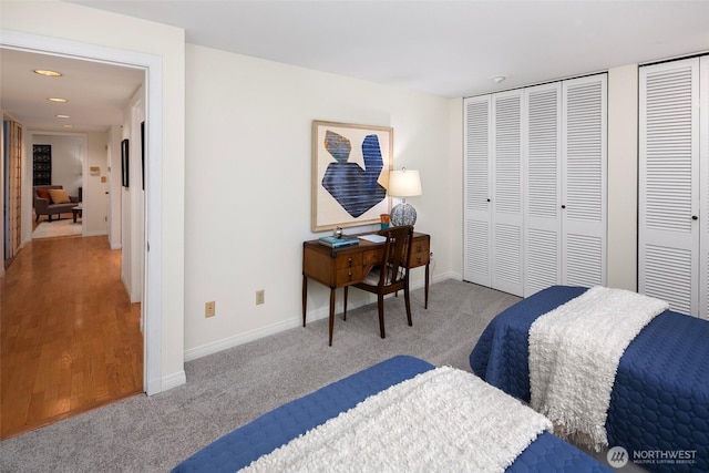 carpeted bedroom featuring recessed lighting and baseboards