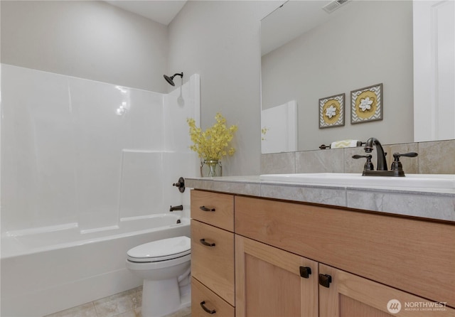 bathroom featuring visible vents, toilet, washtub / shower combination, tile patterned flooring, and vanity