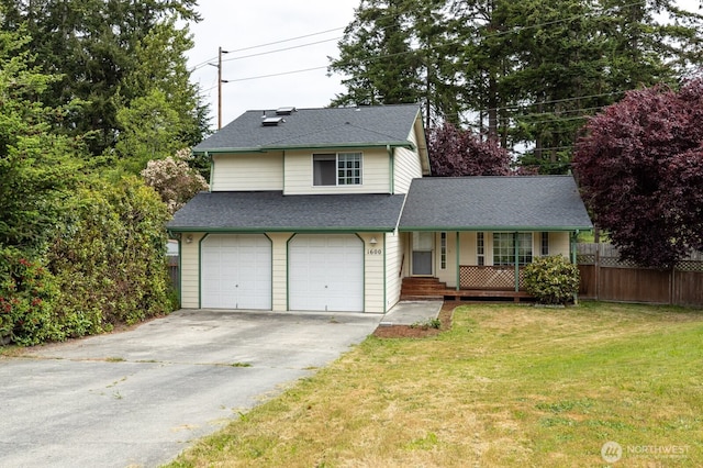 traditional-style home with a front lawn, fence, concrete driveway, roof with shingles, and covered porch