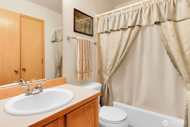 full bath featuring shower / tub combo, toilet, and vanity