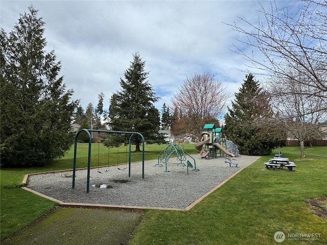 community jungle gym featuring a lawn