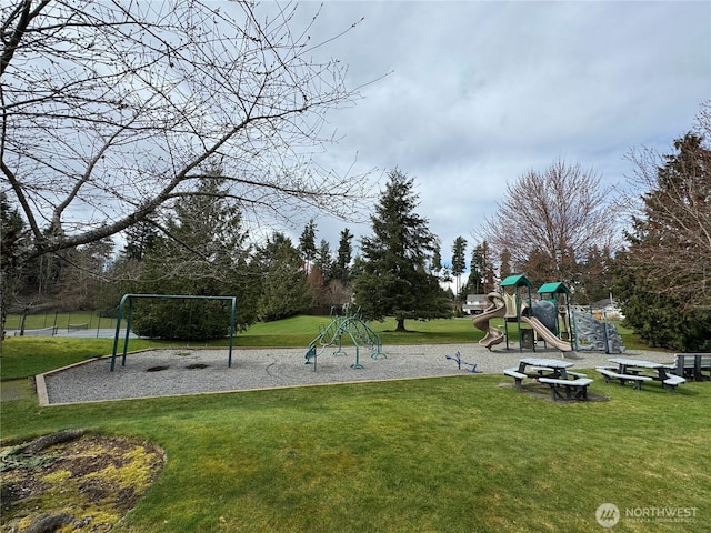 community playground featuring a lawn