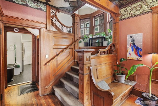 stairway featuring wood-type flooring