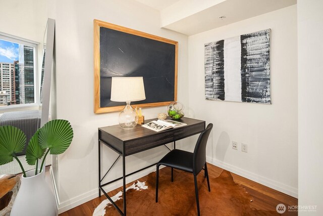 home office with baseboards and wood finished floors