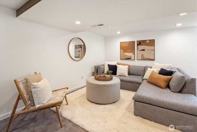 living room with recessed lighting, visible vents, baseboards, and beamed ceiling