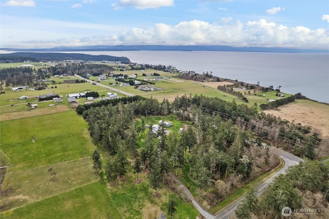 birds eye view of property featuring a rural view and a water view