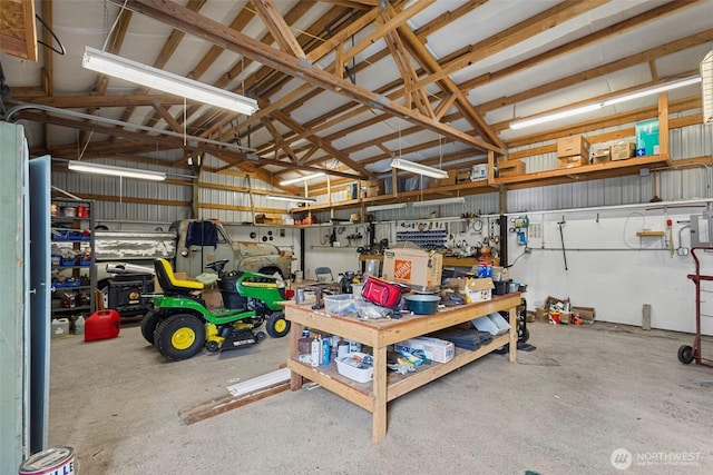 garage featuring metal wall and a workshop area