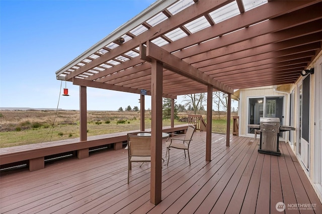 wooden terrace featuring area for grilling and a pergola