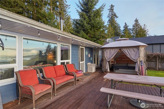 wooden deck featuring a gazebo