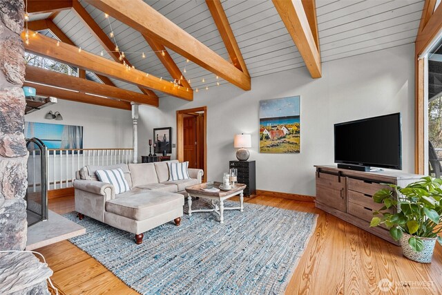 living room with wood ceiling, lofted ceiling with beams, baseboards, and wood finished floors