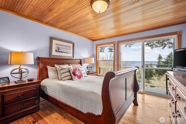 bedroom featuring access to exterior, wood ceiling, light wood-style floors, and ornamental molding