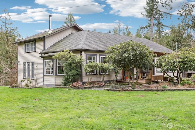 back of house featuring a yard