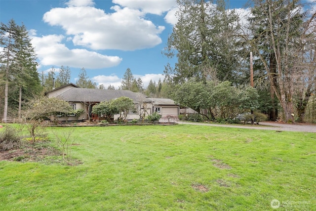 view of yard with an attached garage