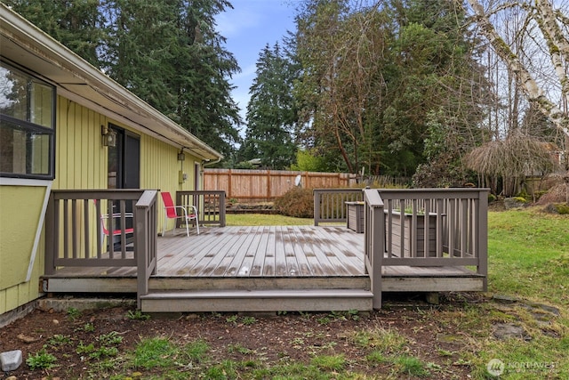 deck with a fenced backyard