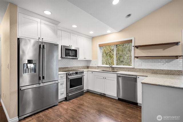 kitchen with a sink, stainless steel appliances, open shelves, and dark wood-type flooring