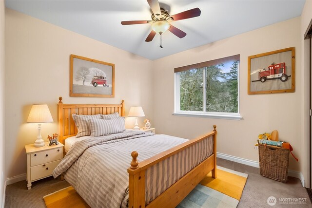 bedroom with carpet flooring, ceiling fan, and baseboards