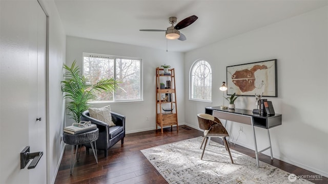 office with baseboards, wood-type flooring, and ceiling fan