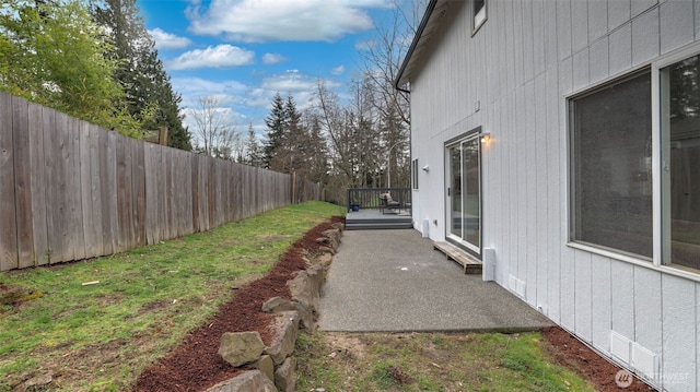 view of yard with a patio and a fenced backyard