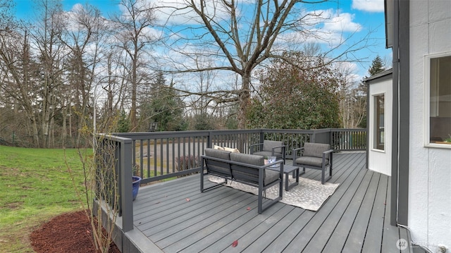 wooden terrace with a lawn and an outdoor hangout area